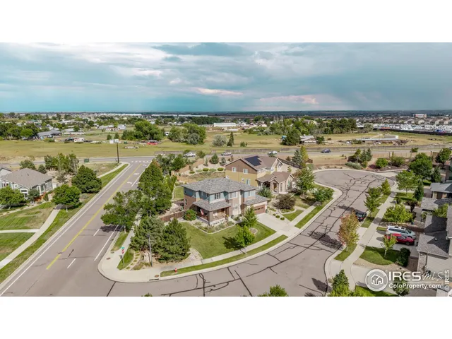 an aerial view of residential building and ocean