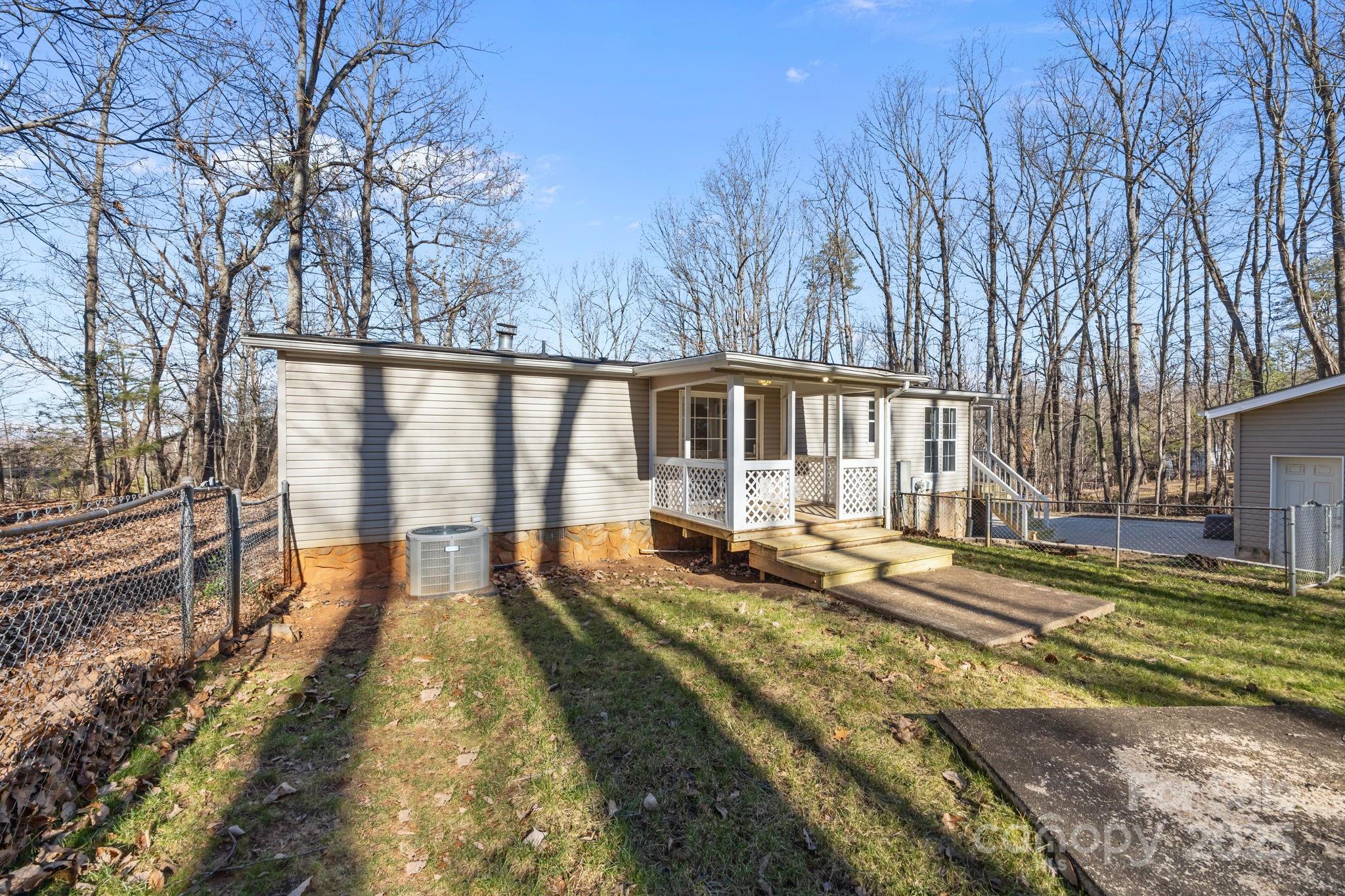 5043 Pebble Stone Road Maiden, NC 28650 - Photo 18 of 46 a view of a house with backyard and sitting area