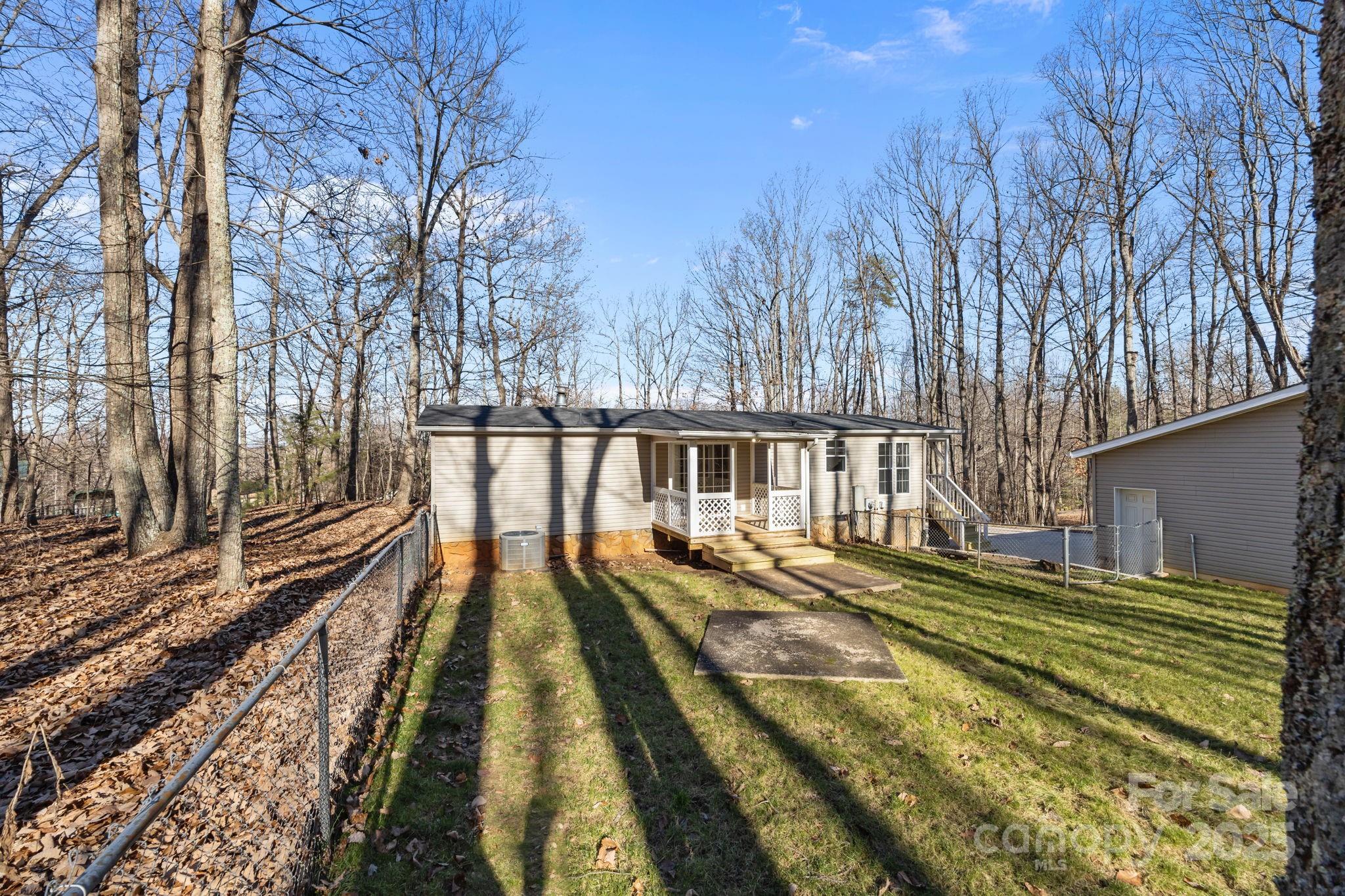 5043 Pebble Stone Road Maiden, NC 28650 - Photo 19 of 46 a view of swimming pool with trees in the background