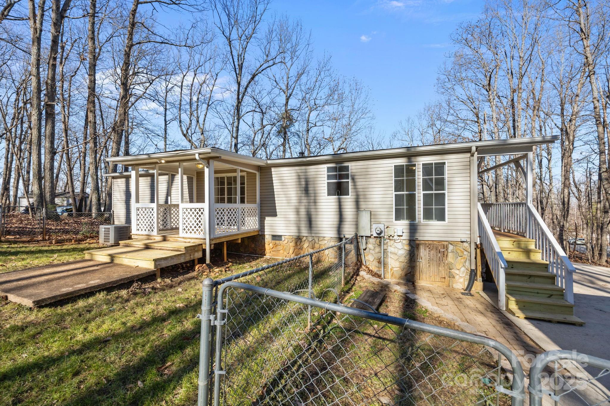 5043 Pebble Stone Road Maiden, NC 28650 - Photo 20 of 46 a view of a house with backyard and sitting area