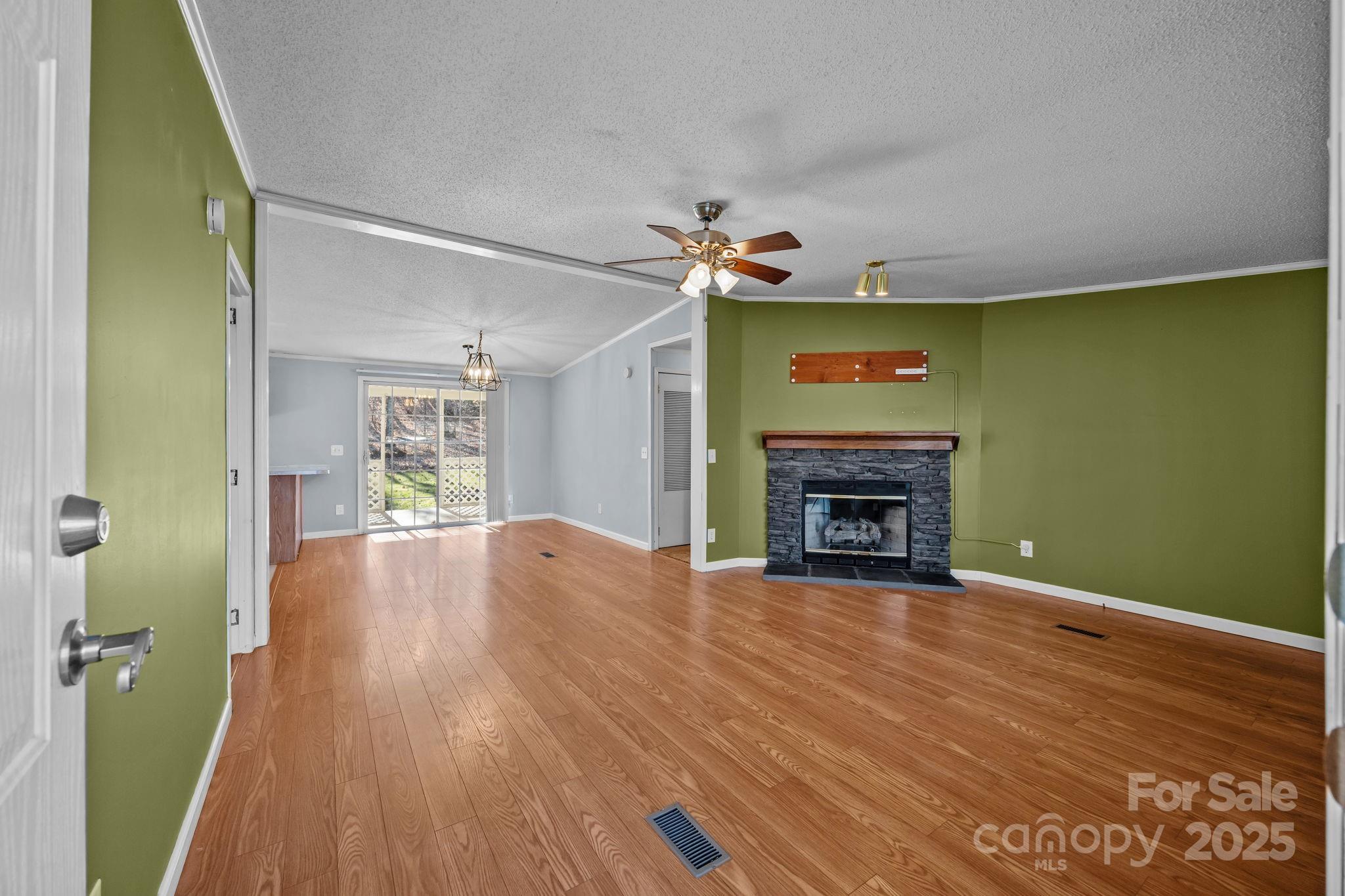 5043 Pebble Stone Road Maiden, NC 28650 - Photo 24 of 46 a view of an empty room with a fireplace and a window