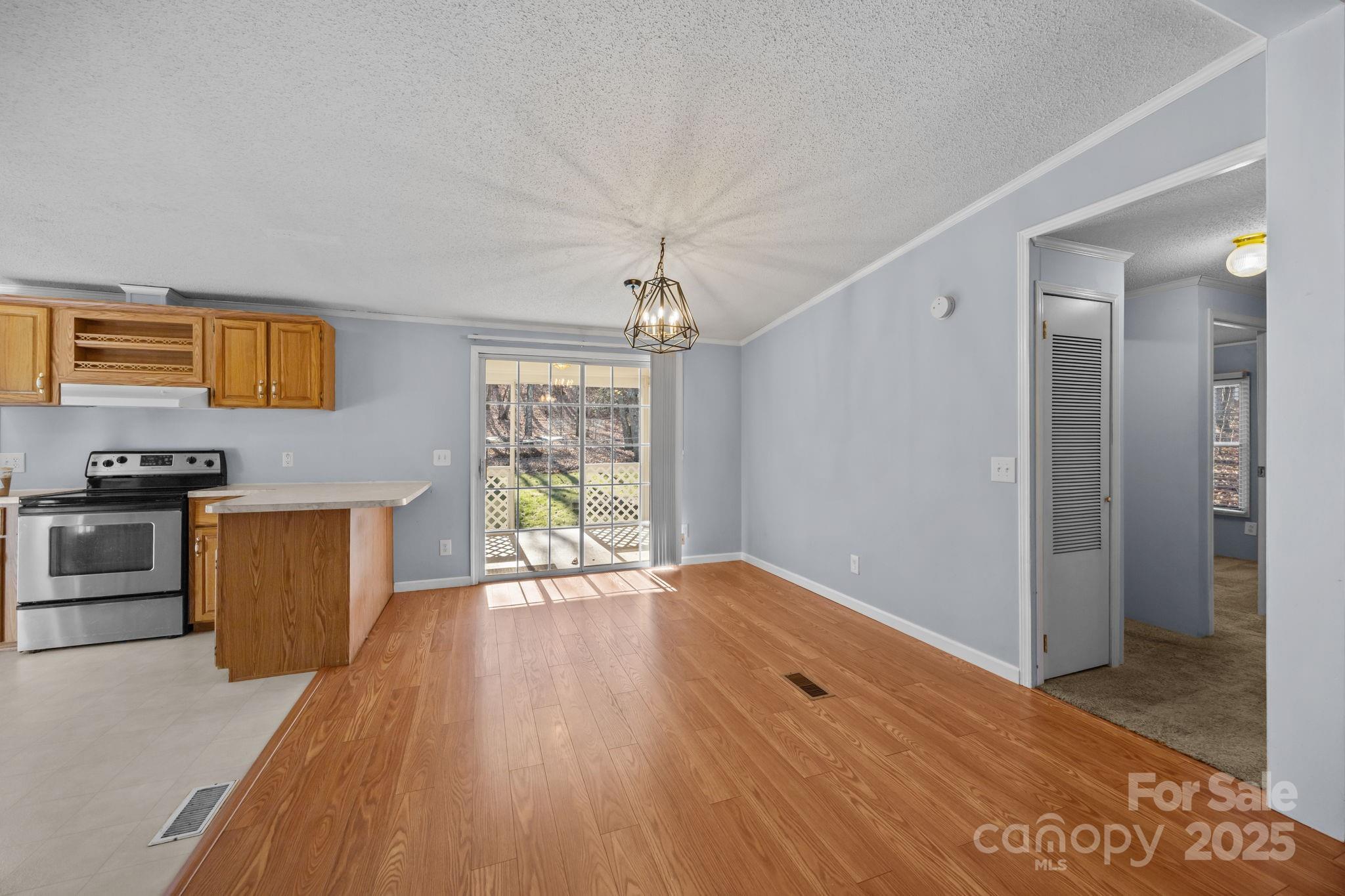 5043 Pebble Stone Road Maiden, NC 28650 - Photo 27 of 46 a view of kitchen with furniture and wooden floor