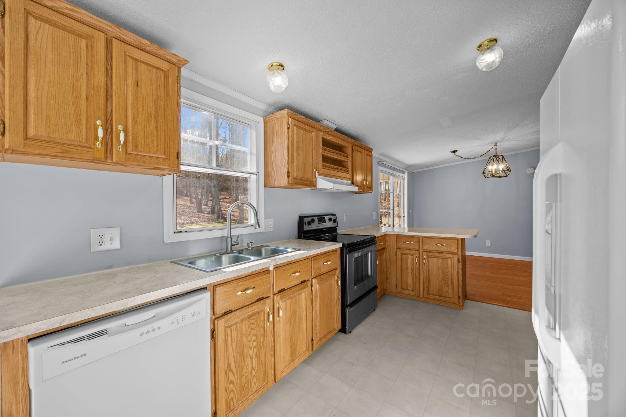 5043 Pebble Stone Road Maiden, NC 28650 - Photo 31 of 46 a kitchen with a sink stove and cabinets