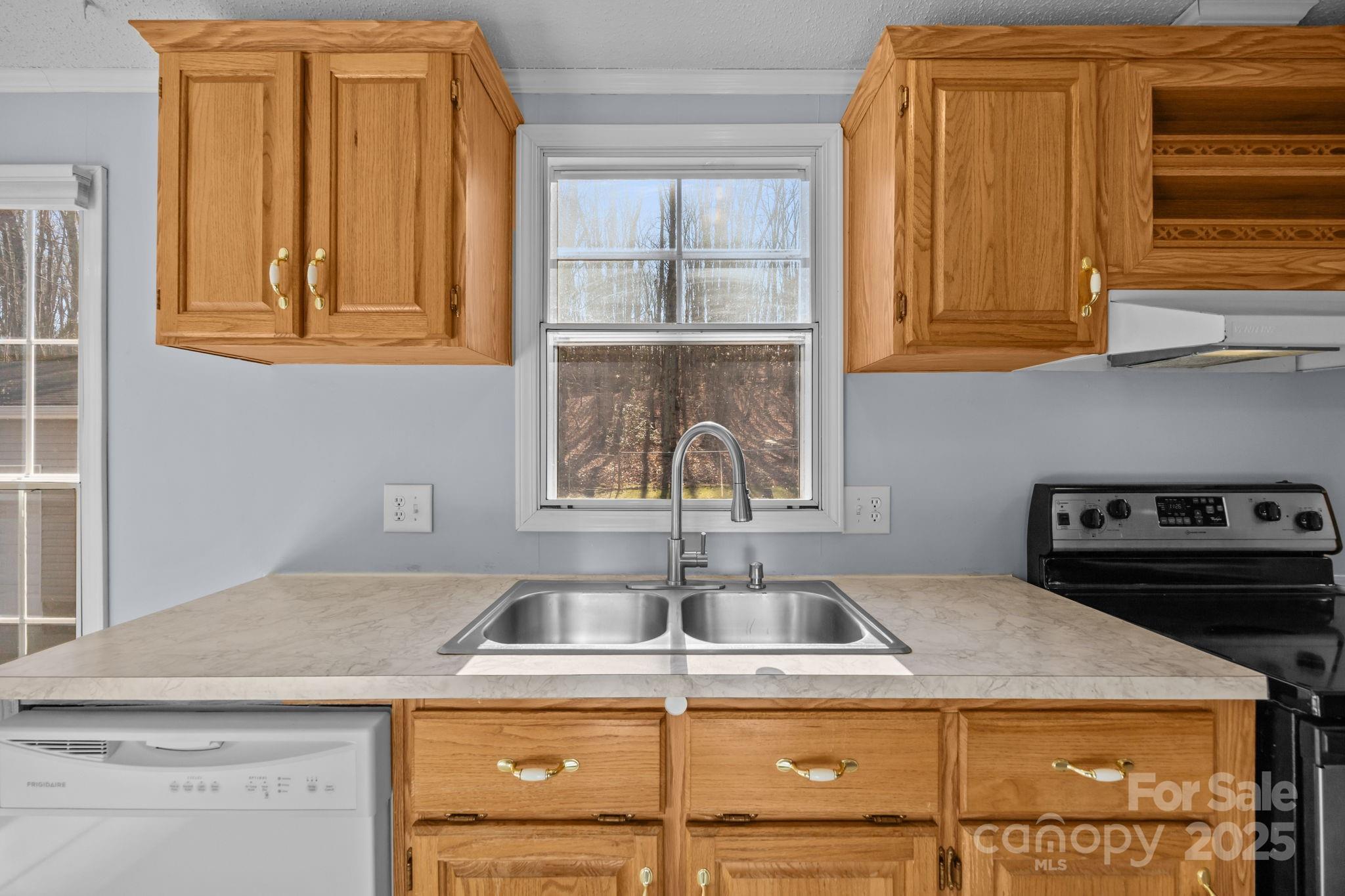 5043 Pebble Stone Road Maiden, NC 28650 - Photo 33 of 46 a kitchen with a stove and a sink