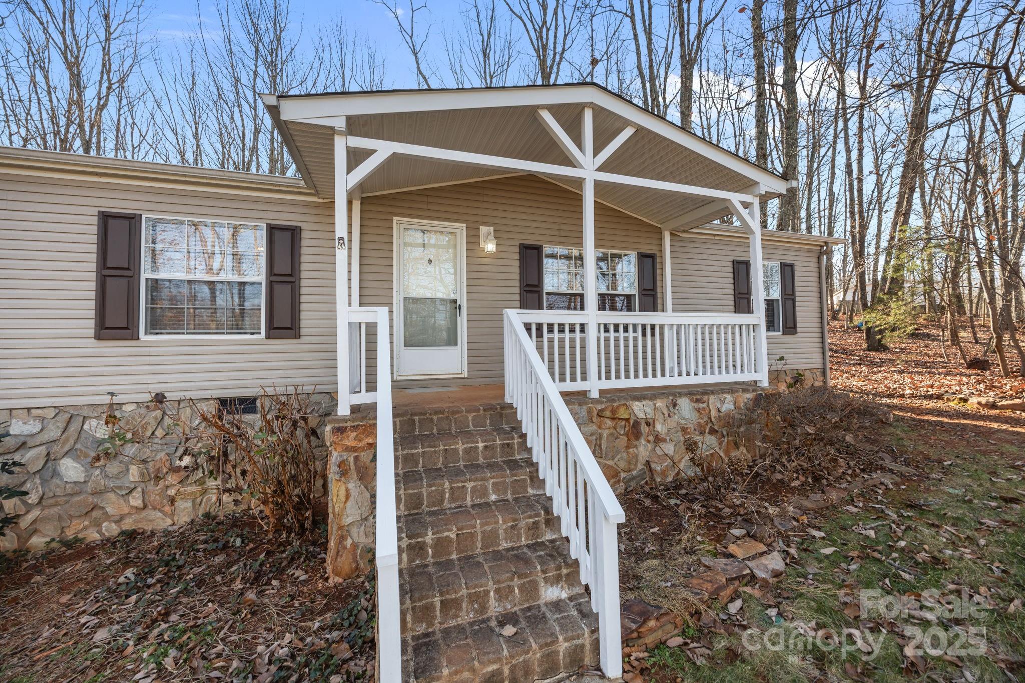 5043 Pebble Stone Road Maiden, NC 28650 - Photo 4 of 46 a front view of a house with a yard