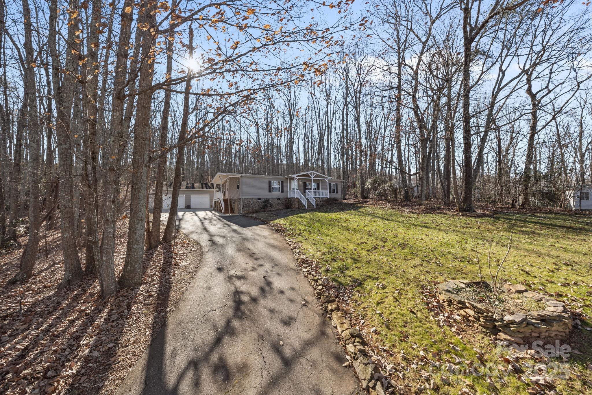 5043 Pebble Stone Road Maiden, NC 28650 - Photo 8 of 46 a view of a backyard with large trees