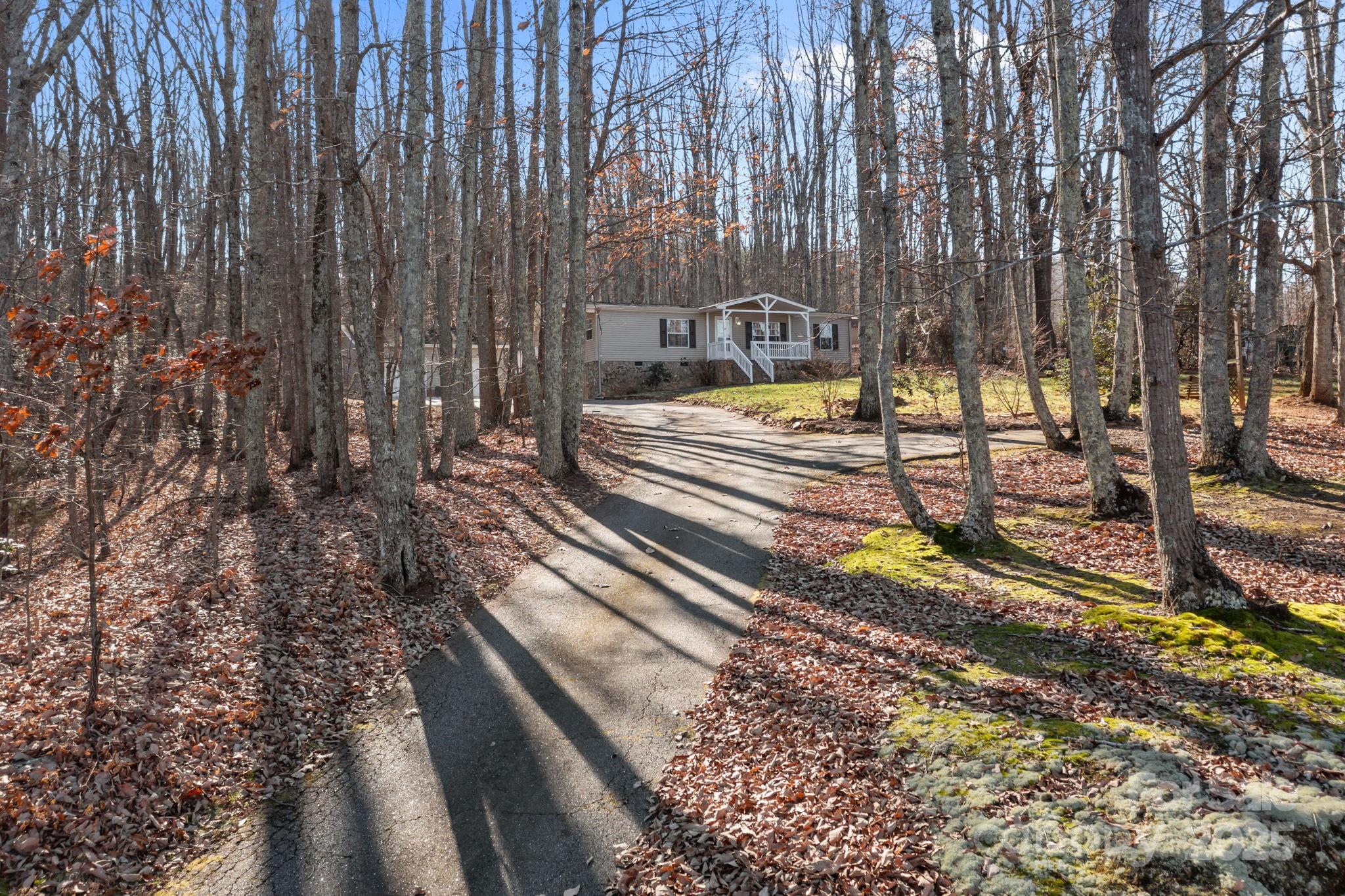 5043 Pebble Stone Road Maiden, NC 28650 - Photo 9 of 46 a view of a backyard with trees