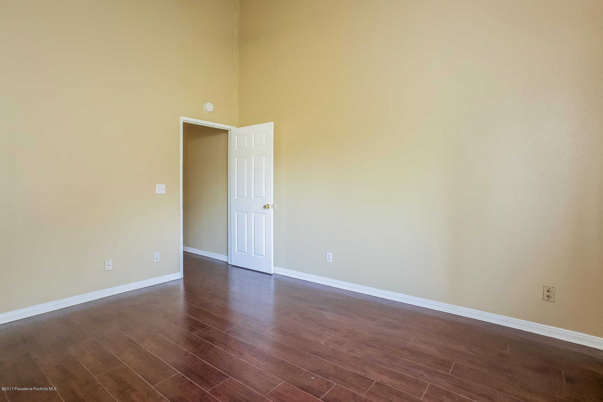 248 East Washington Boulevard, Unit 4 Pasadena, CA 91104 - Photo 11 of 19 a view of an empty room with wooden floor