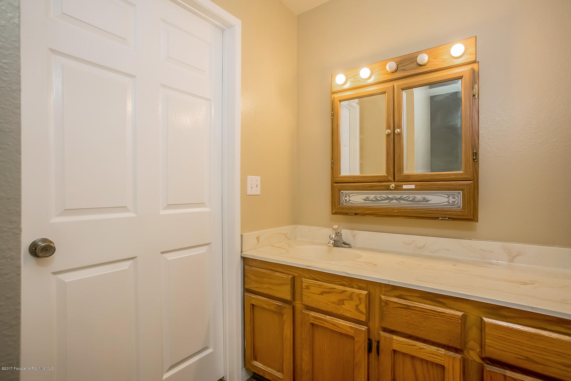 248 East Washington Boulevard, Unit 4 Pasadena, CA 91104 - Photo 12 of 19 a bathroom with a sink and a mirror