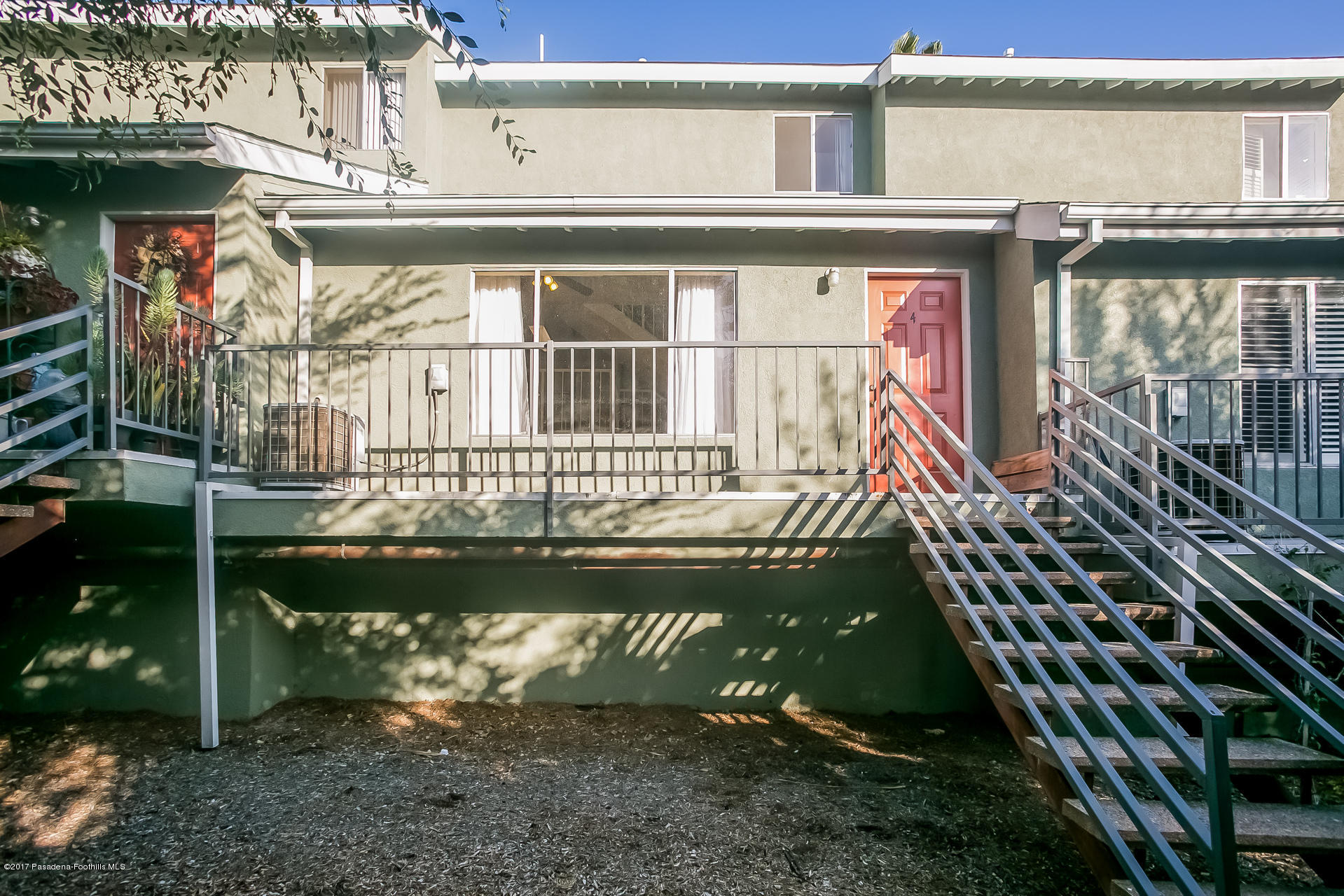 248 East Washington Boulevard, Unit 4 Pasadena, CA 91104 - Photo 16 of 19 a front view of a house with a garden