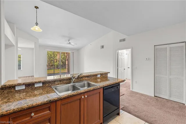 a kitchen with a sink stove and refrigerator