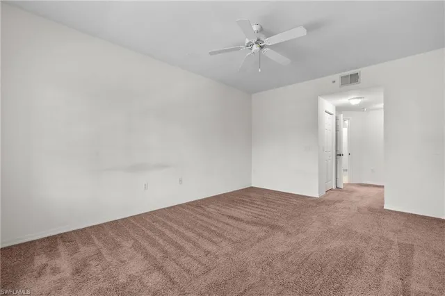 a kitchen with a sink and a granite counter top