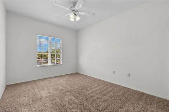 a bathroom with a granite countertop sink a mirror and a shower