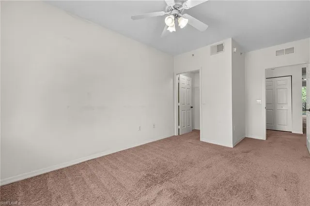 a spacious bathroom with a double vanity sink a mirror and a shower