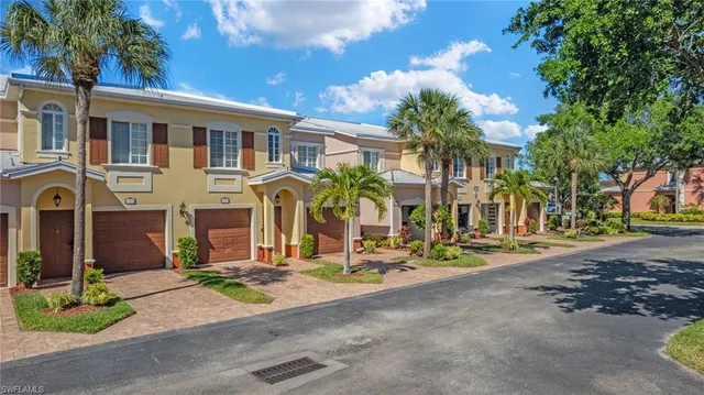 a view of balcony with floor to ceiling window and palm tree