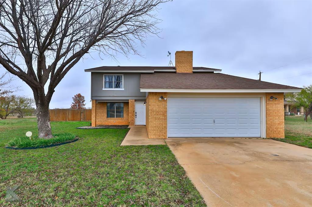 20319 County Road 304 Abilene, TX 79601 - Photo 1 of 1 a front view of a house with garden