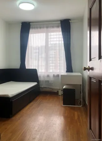 a bedroom with a bed and a fireplace