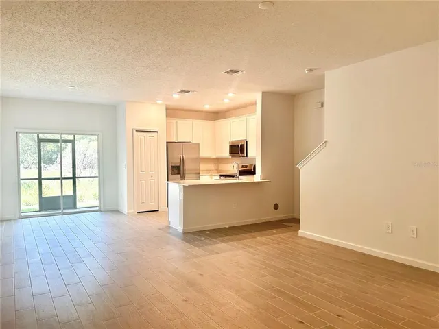 a view of kitchen with wooden floor