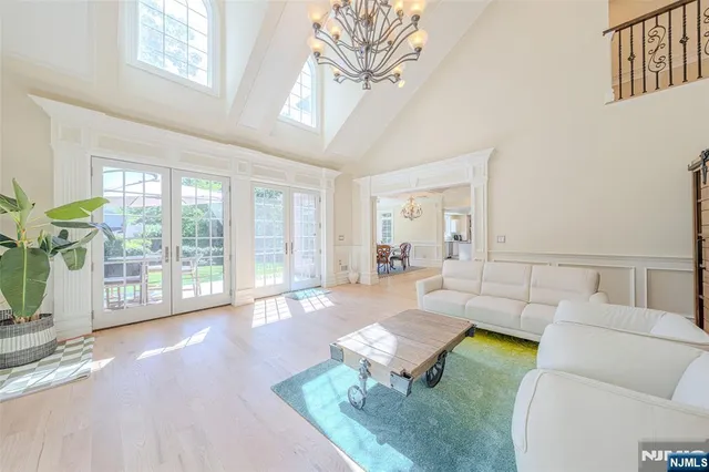 a view of a livingroom with workspace and a couch