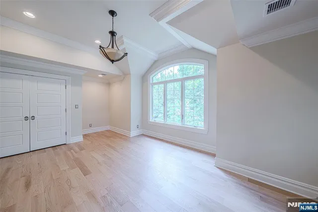 a bathroom with a granite countertop sink toilet a mirror a vanity and shower