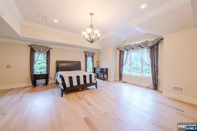 a living room with fireplace furniture and a wooden floor