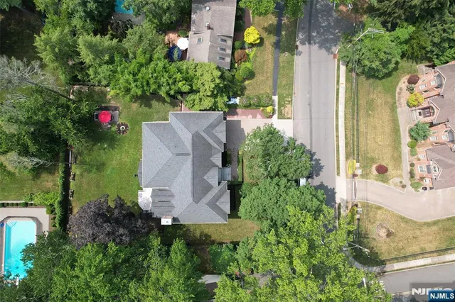 an aerial view of a house with outdoor space
