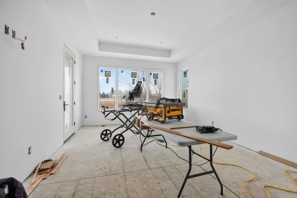 a view of a livingroom with furniture and gym equipment