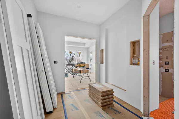 a living room with furniture and a painting on the wall
