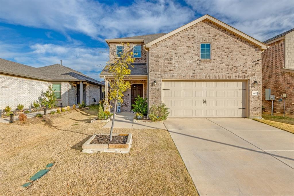 14033 Gaskin Street Pilot Point, TX 76258 - Photo 1 of 12 a front view of a house with a yard