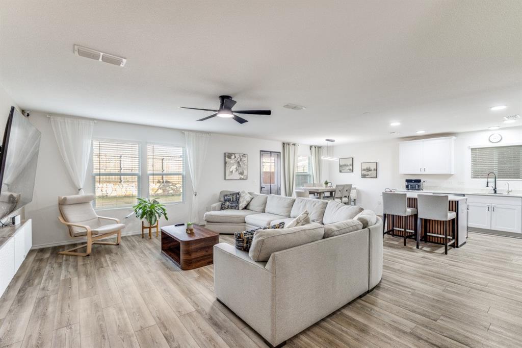 14033 Gaskin Street Pilot Point, TX 76258 - Photo 11 of 12 a living room with furniture and a large window