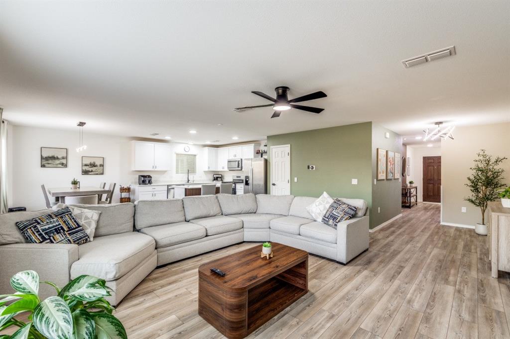 14033 Gaskin Street Pilot Point, TX 76258 - Photo 12 of 12 a living room with furniture and a large window