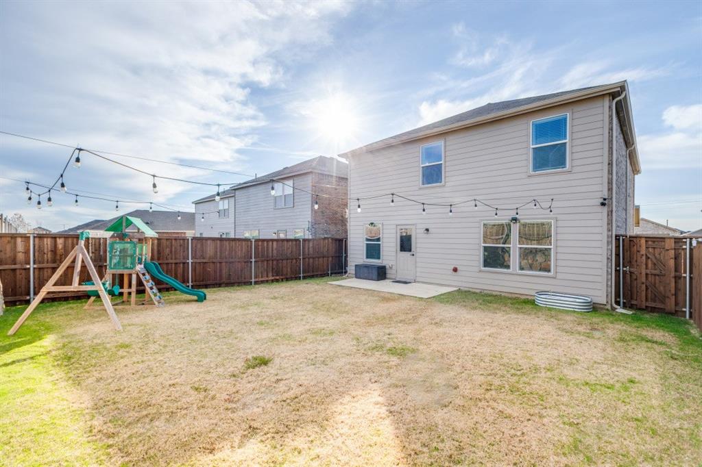 14033 Gaskin Street Pilot Point, TX 76258 - Photo 2 of 12 a view of a backyard of a house