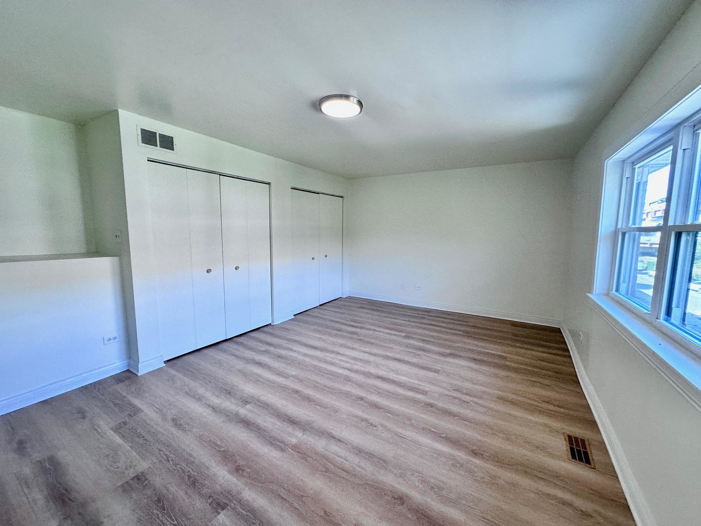 611 West 25th Place Chicago, IL 60616 - Photo 9 of 11 wooden floor in an empty room