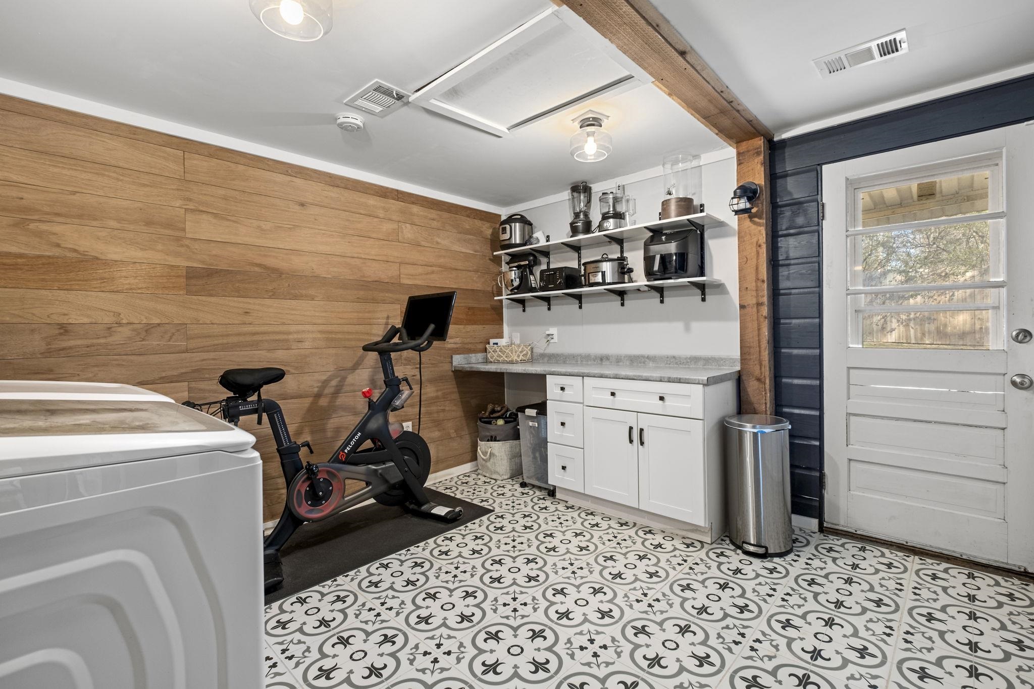4120 Village Road Memphis, TN 38117 - Photo 24 of 28 Exercise room featuring wood walls and washer / dryer