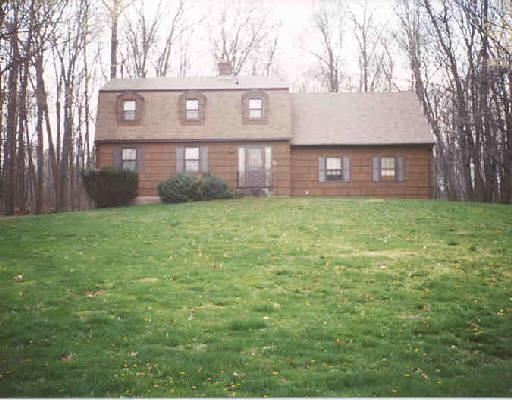 115 Sentry Hill Road Monroe, CT 06468 - Photo 1 of 1 a view of a brick house with a yard