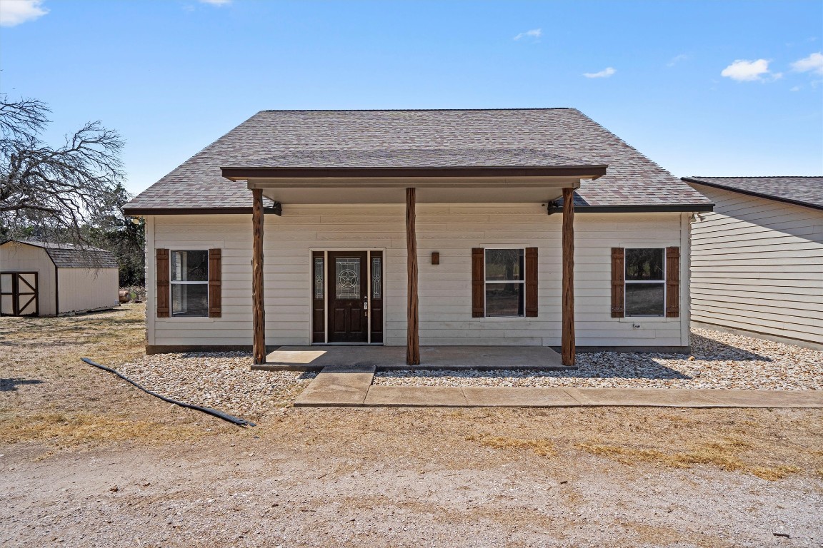 25600 Ronald Reagan Boulevard Georgetown, TX 78633 - Photo 14 of 36 a front view of a house with garden