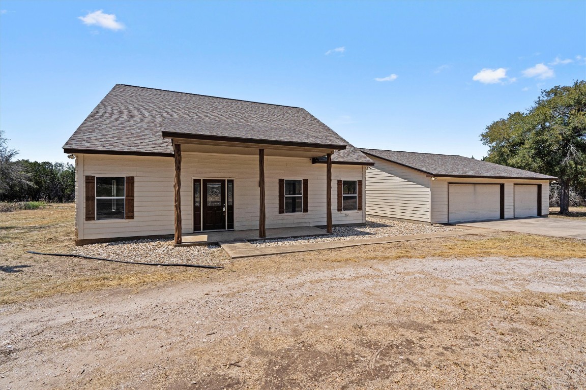 25600 Ronald Reagan Boulevard Georgetown, TX 78633 - Photo 15 of 36 a front view of a house with a garden