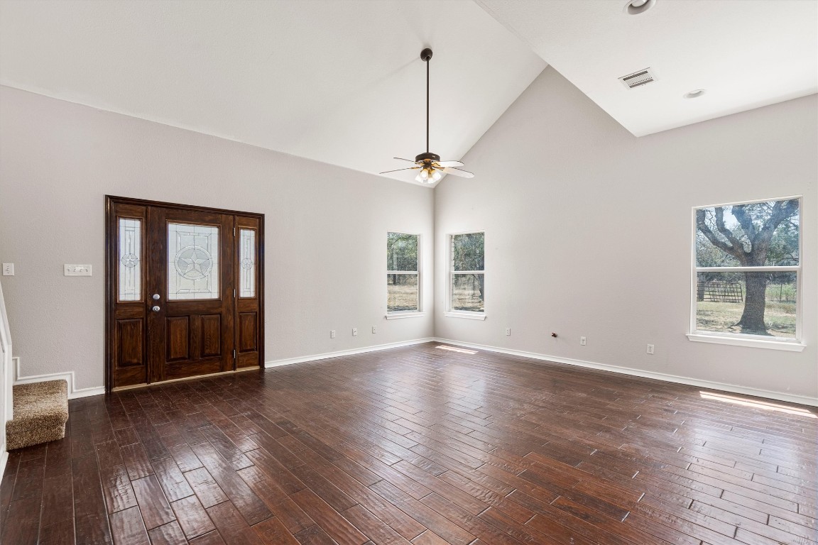 25600 Ronald Reagan Boulevard Georgetown, TX 78633 - Photo 16 of 36 a view of an empty room with wooden floor and a window