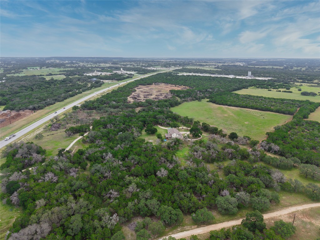 25600 Ronald Reagan Boulevard Georgetown, TX 78633 - Photo 2 of 36 an aerial view of a residential houses with outdoor space and trees