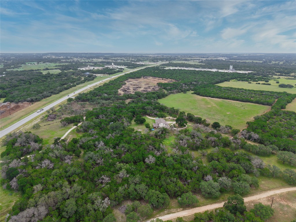 25600 Ronald Reagan Boulevard Georgetown, TX 78633 - Photo 5 of 36 an aerial view of residential houses with outdoor space and trees