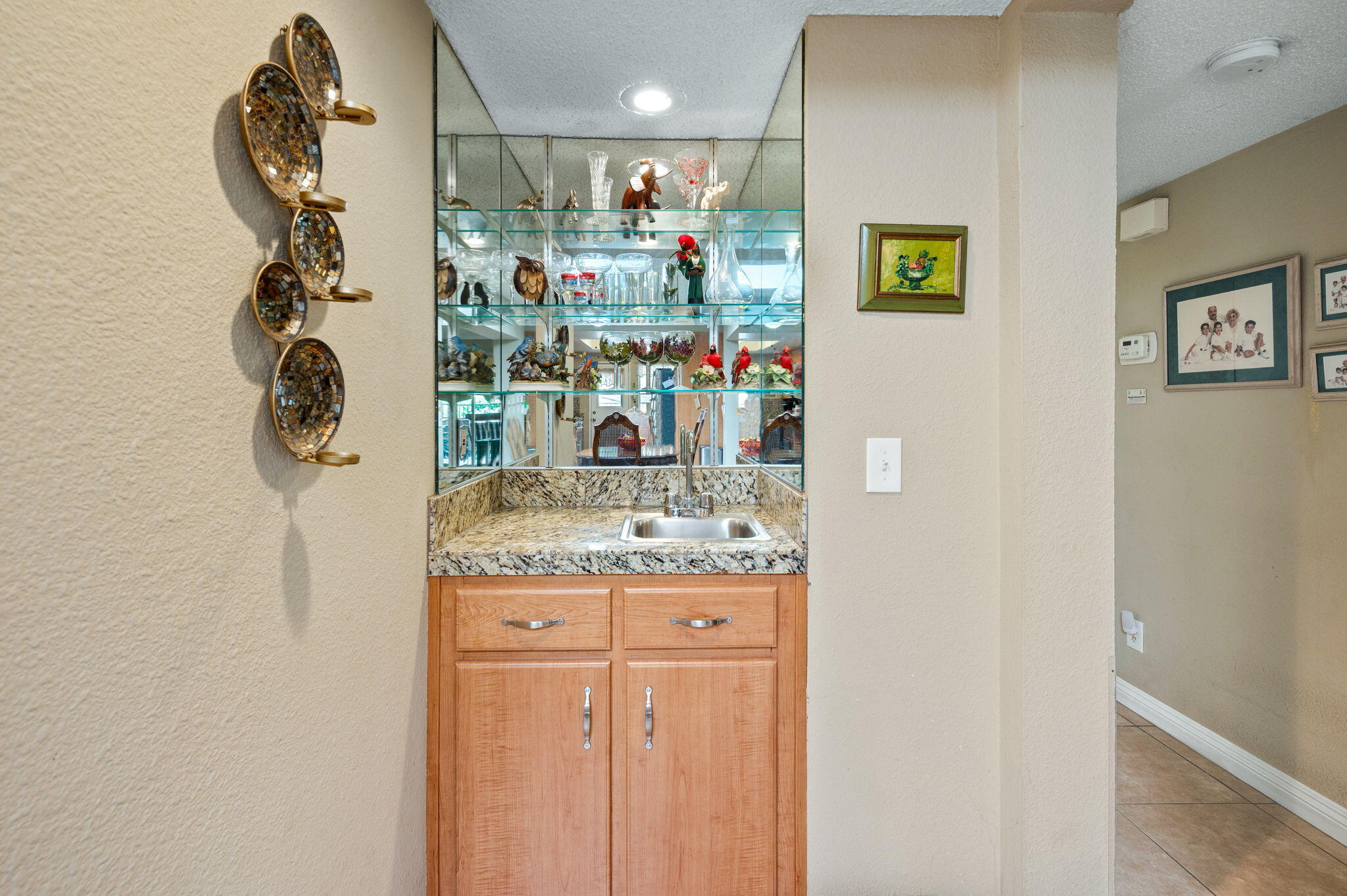 49275 Douglas Street Indio, CA 92201 - Photo 11 of 37 a kitchen with stainless steel appliances granite countertop a sink and a refrigerator