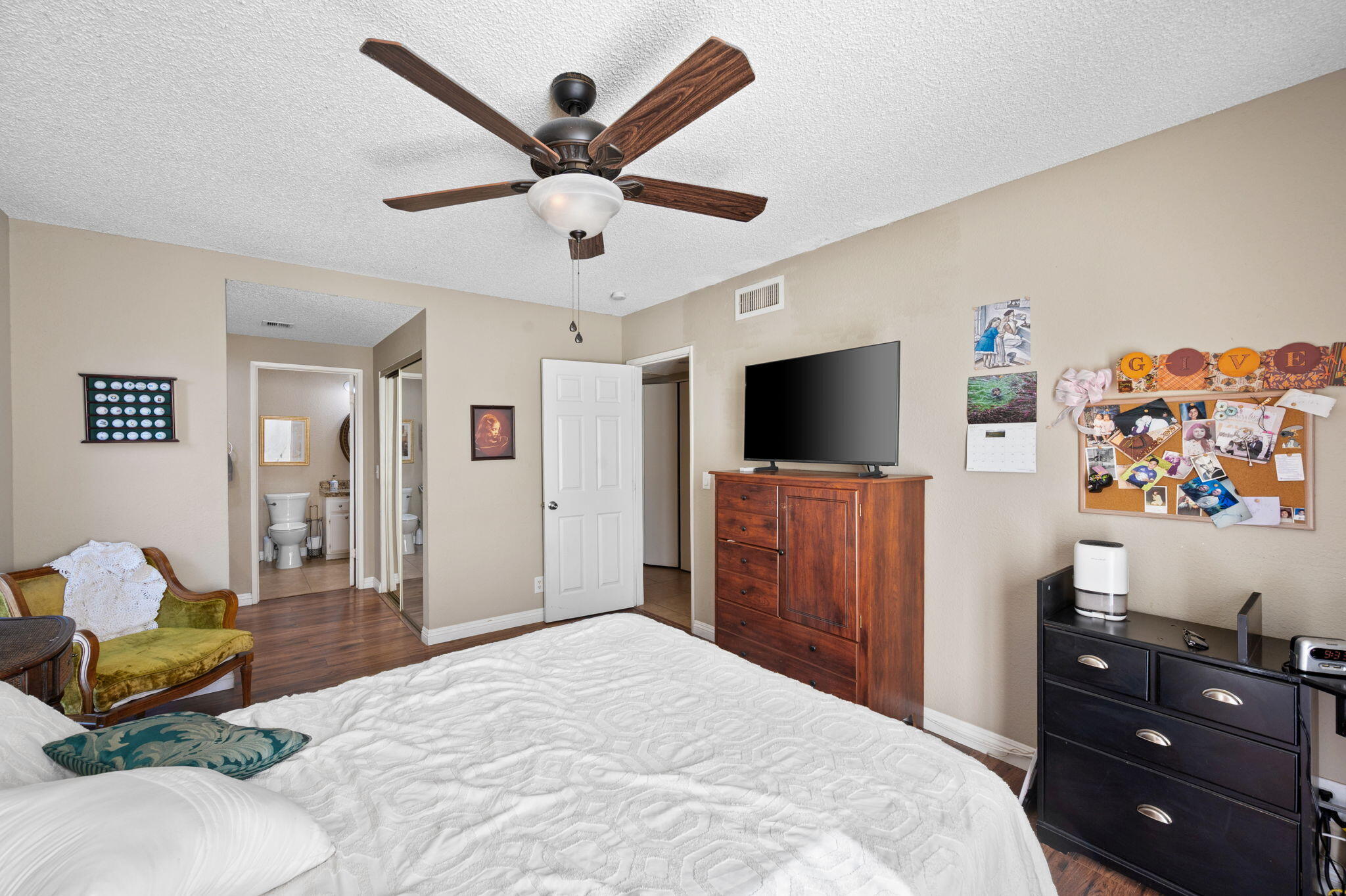 49275 Douglas Street Indio, CA 92201 - Photo 16 of 37 a bedroom with a bed and a flat screen tv