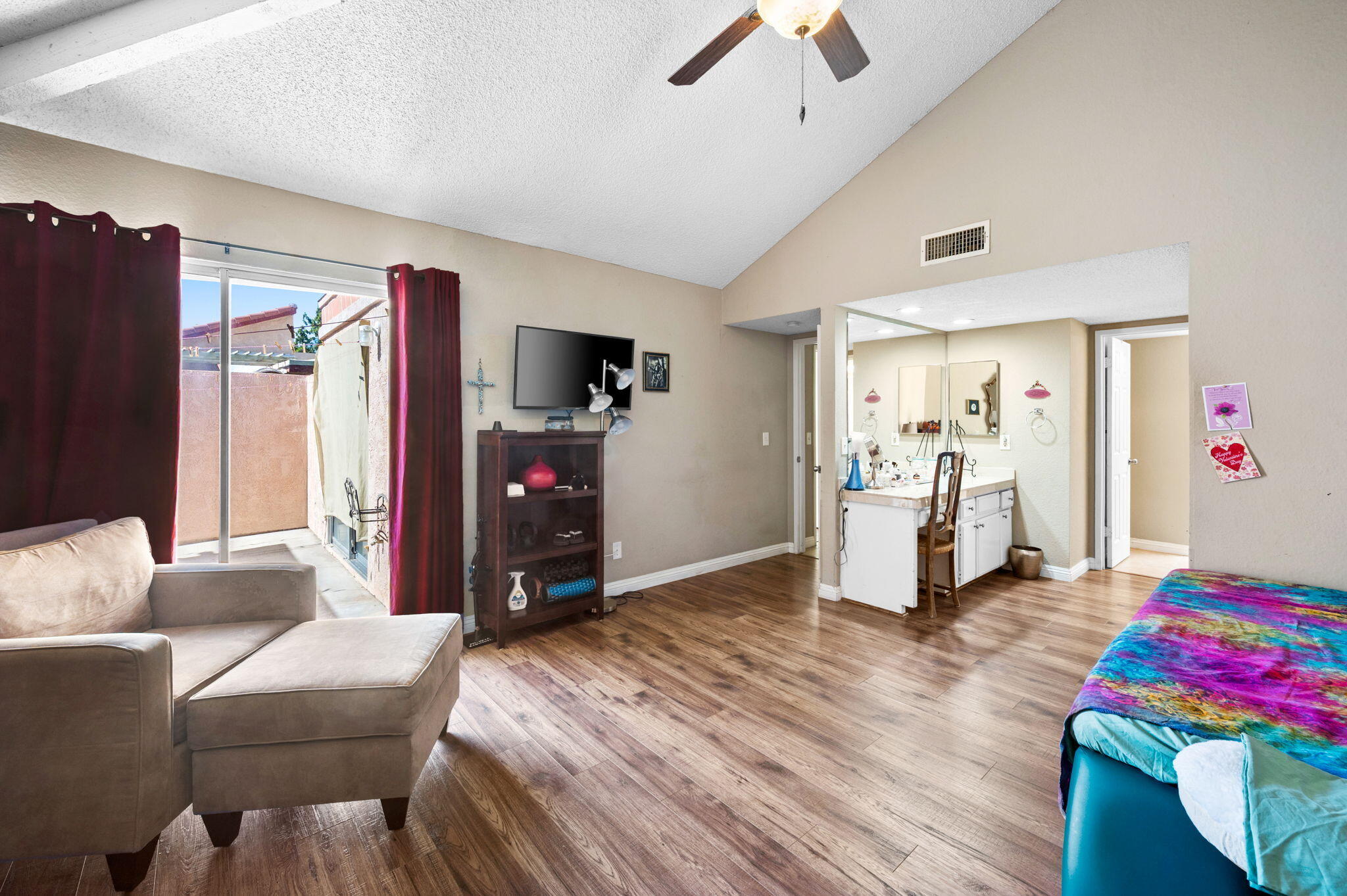 49275 Douglas Street Indio, CA 92201 - Photo 20 of 37 a living room with furniture and a flat screen tv