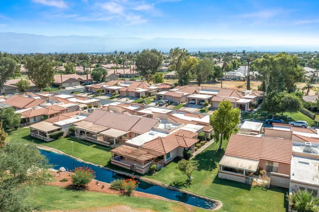 an aerial view of a house with a garden