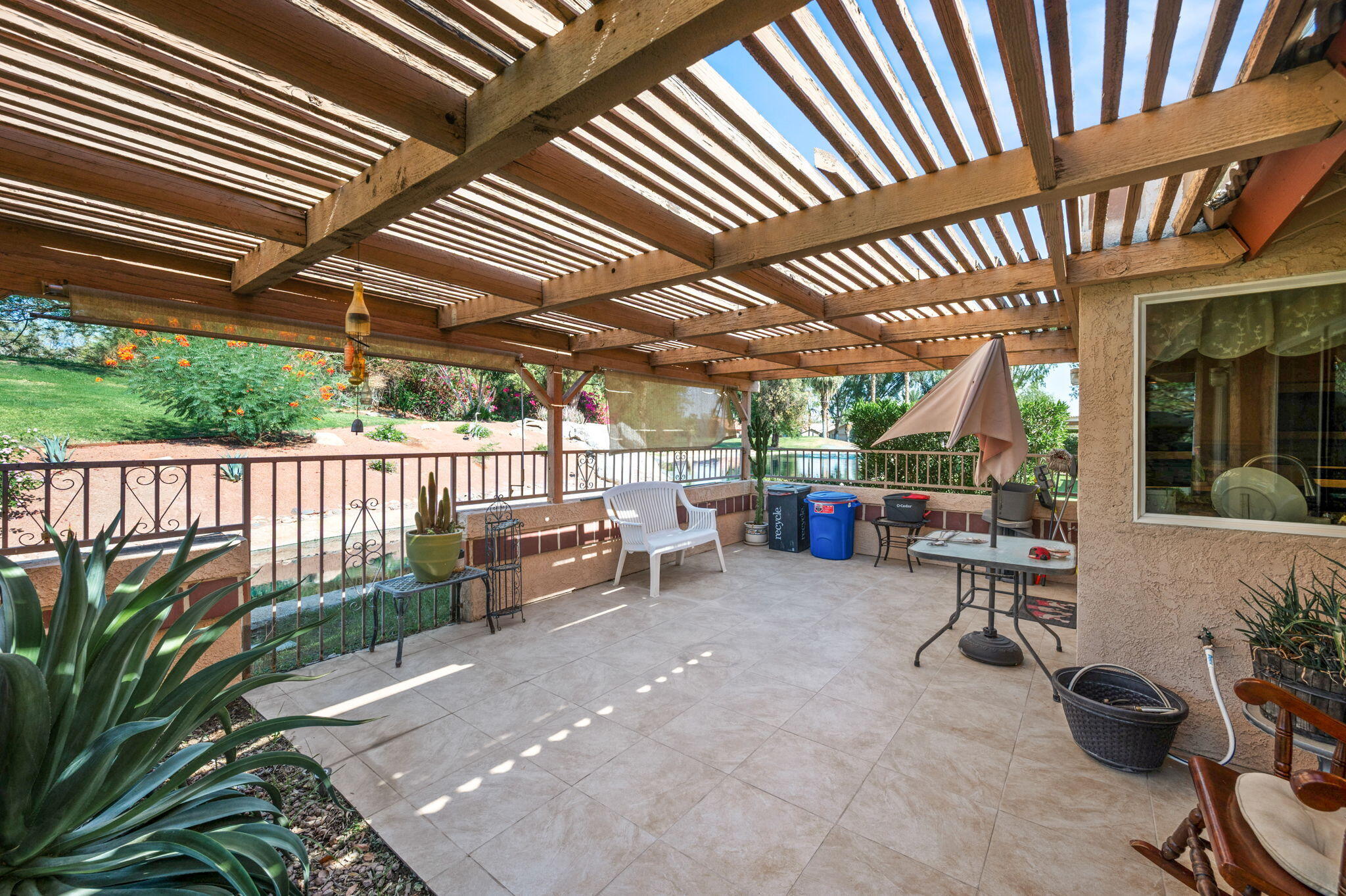 49275 Douglas Street Indio, CA 92201 - Photo 29 of 37 a view of a porch with furniture and garden