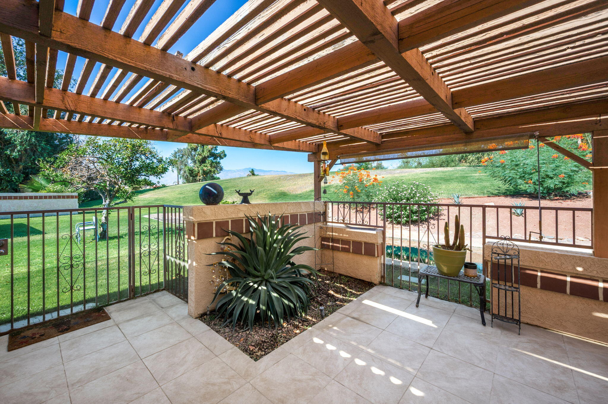 49275 Douglas Street Indio, CA 92201 - Photo 34 of 37 a view of a porch with furniture and backyard