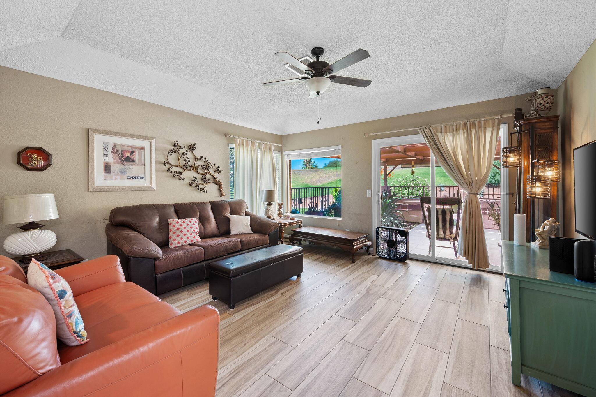 49275 Douglas Street Indio, CA 92201 - Photo 4 of 37 a living room with furniture and a large window