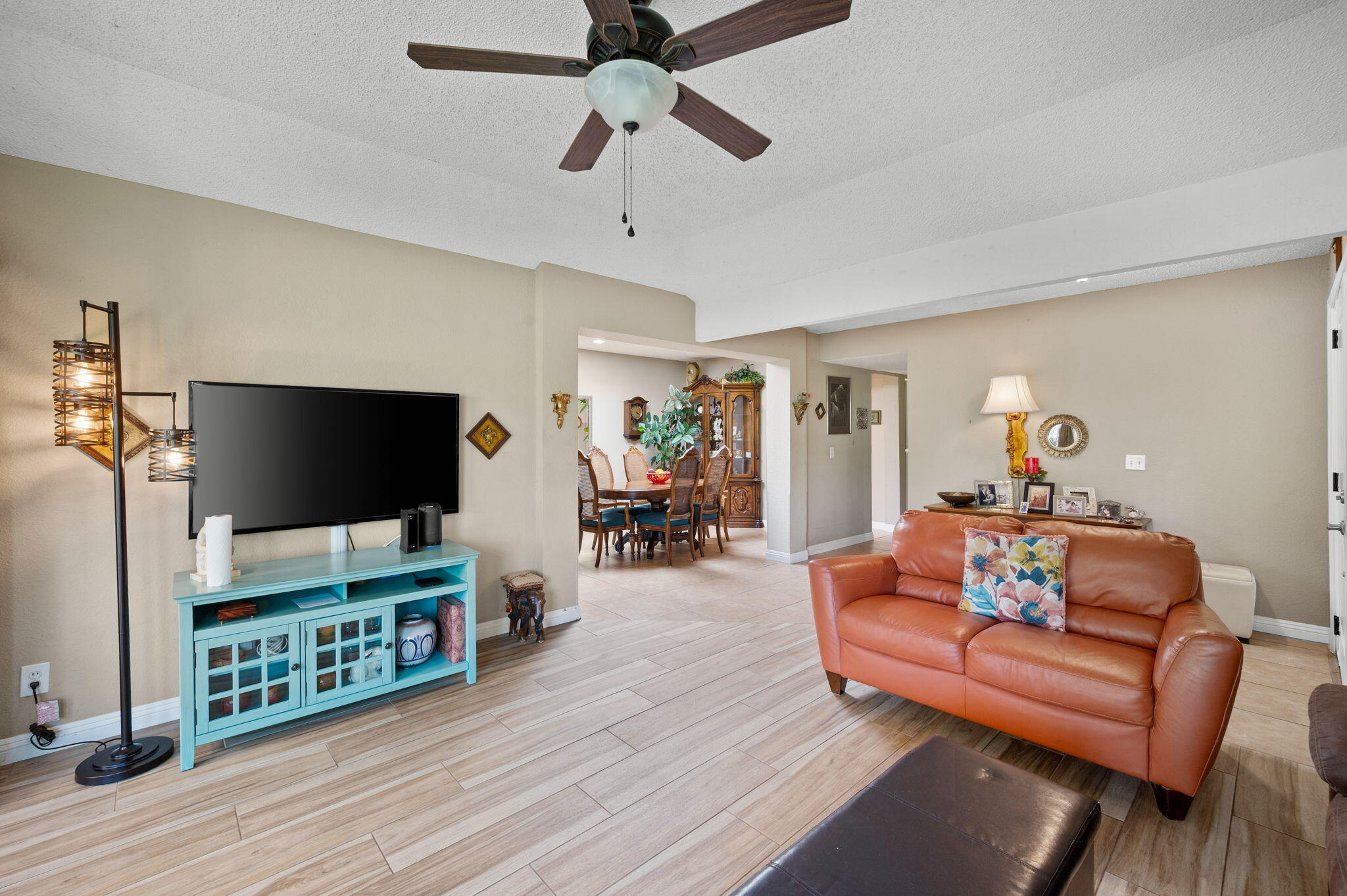 49275 Douglas Street Indio, CA 92201 - Photo 5 of 37 a living room with furniture and a flat screen tv