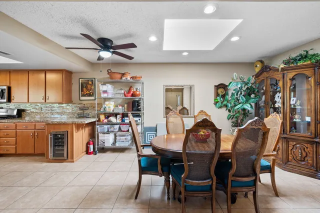 a view of a dining room with furniture and window