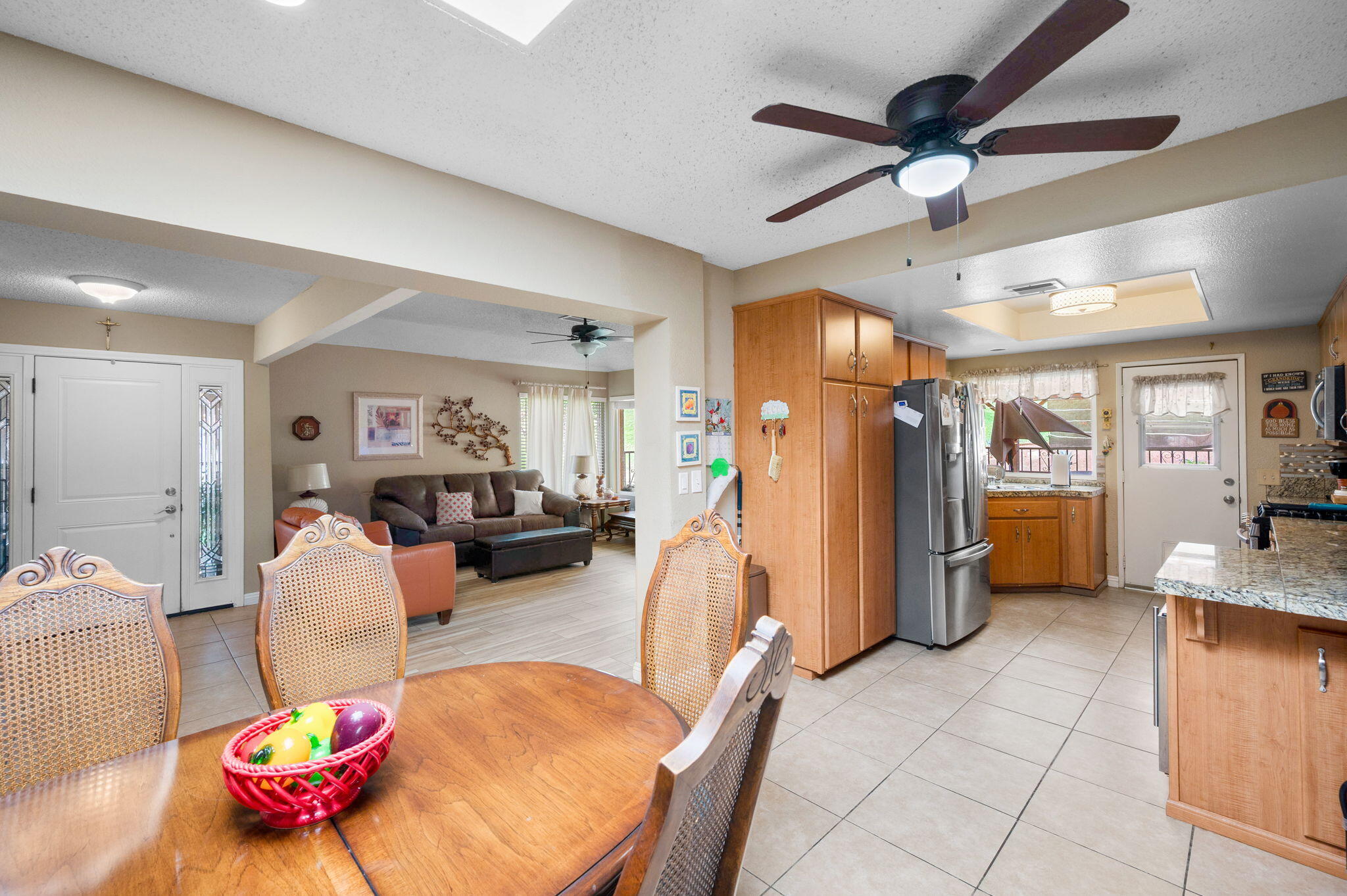 49275 Douglas Street Indio, CA 92201 - Photo 8 of 37 a living room with furniture and kitchen view